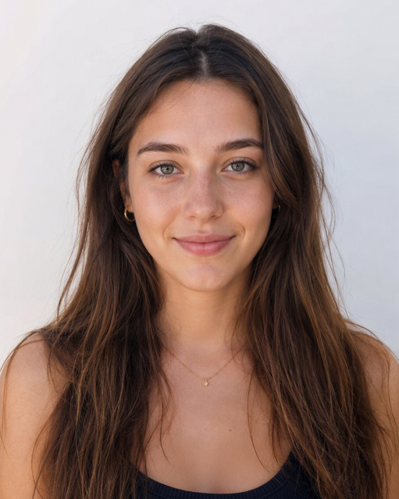 Front-facing portrait of a woman with long brown hair