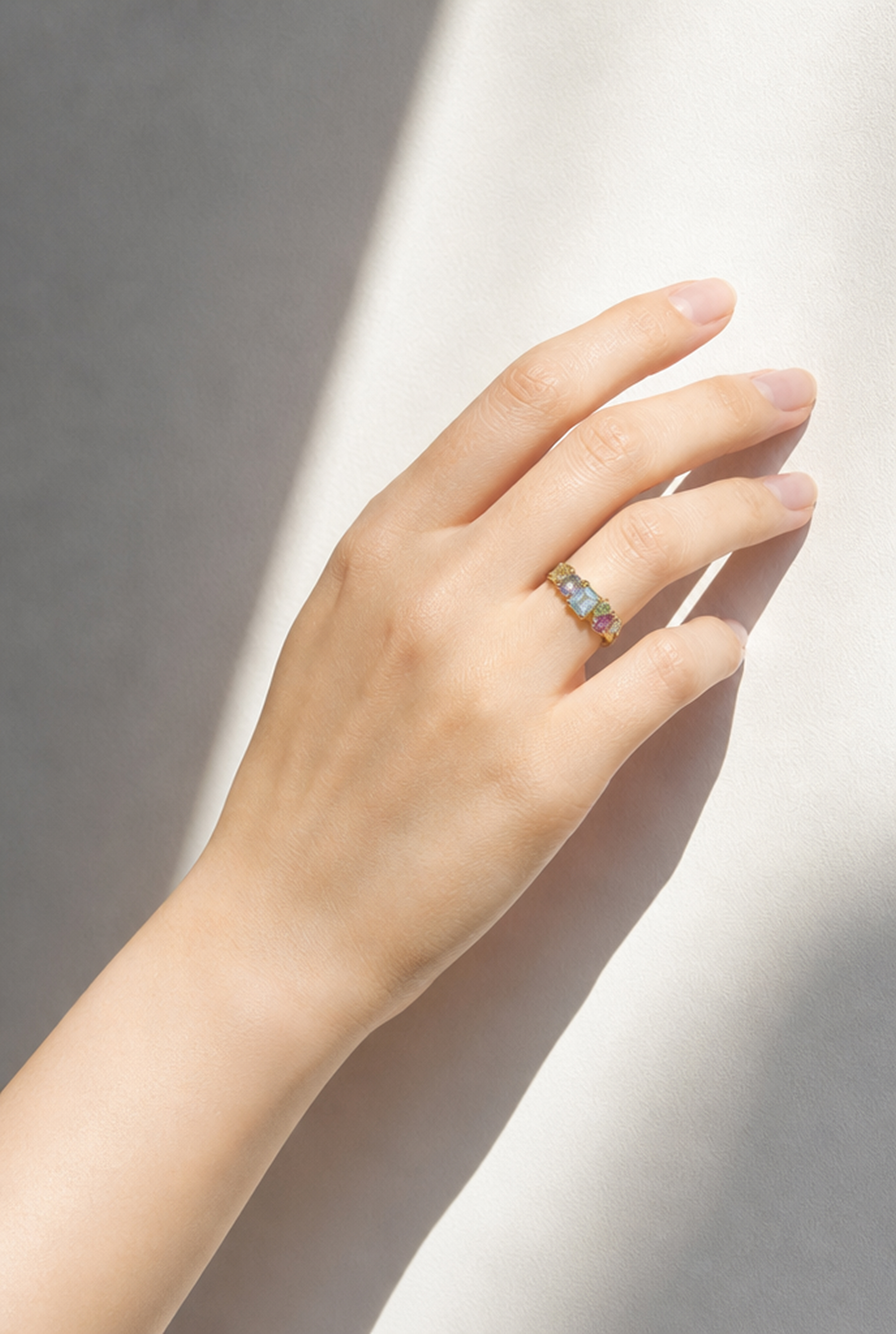 Colorful gemstone ring virtually placed on the hand